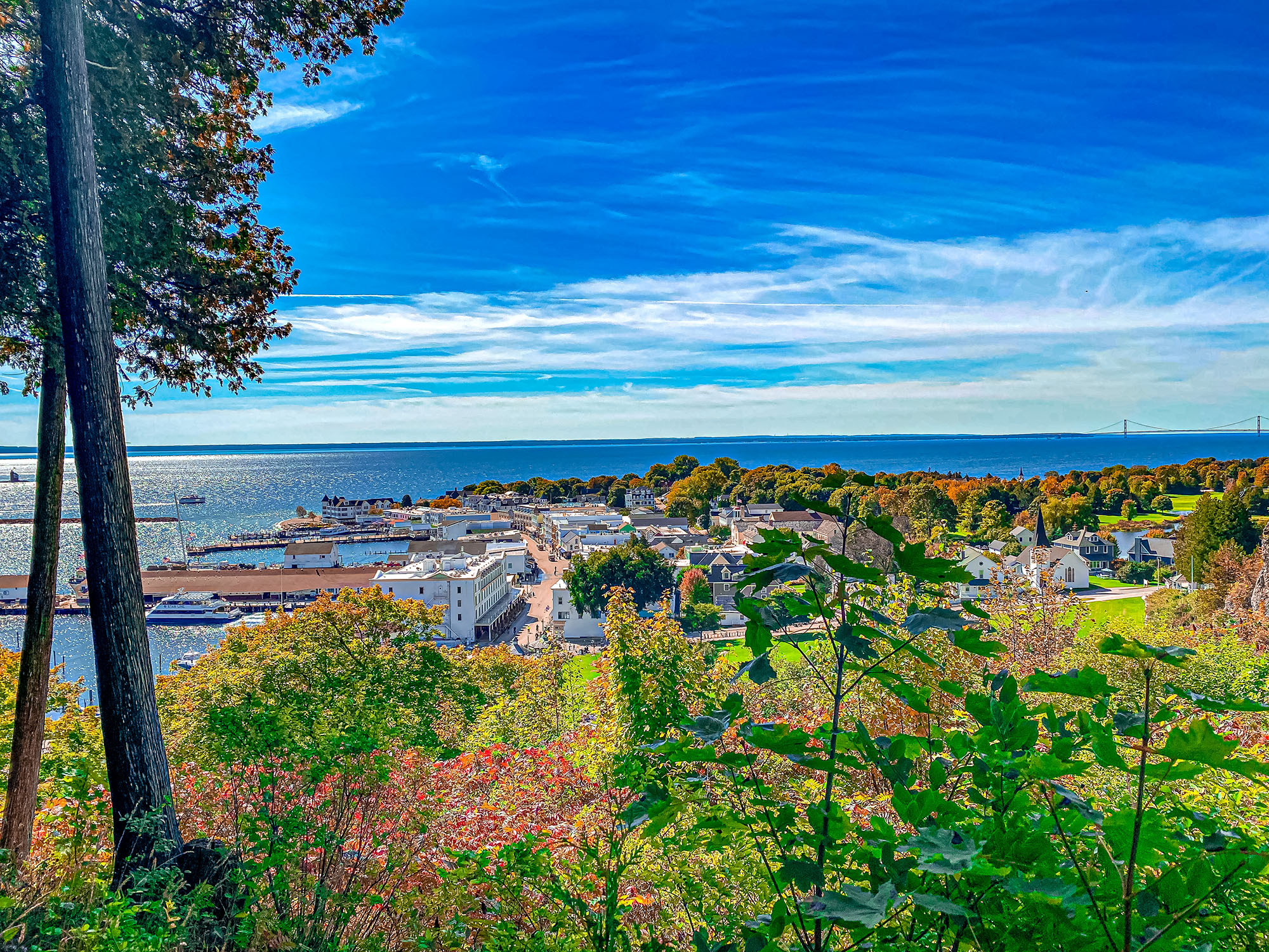 Where to go banner - looking down on Mackinac Island from a hill top.