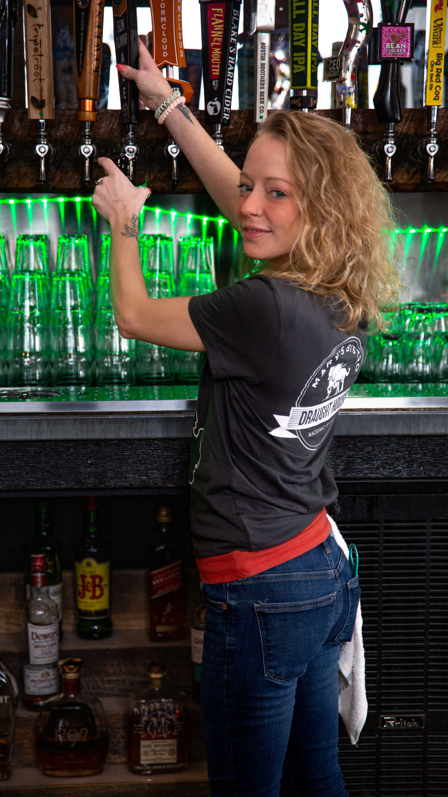 mary's bistro employee pouring beer