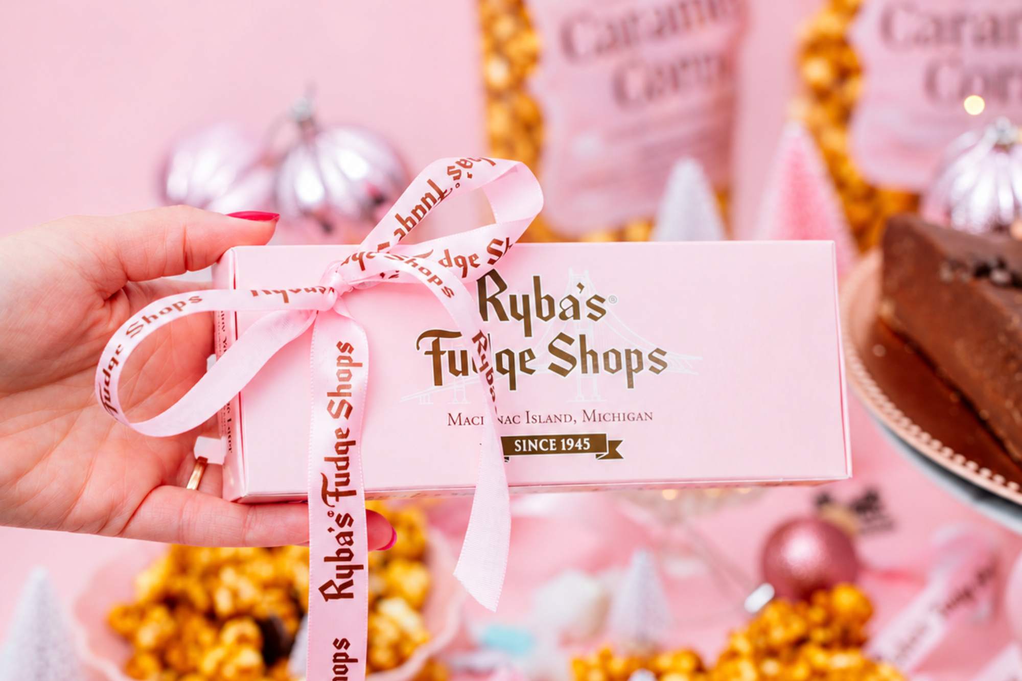 An iconic pink ryba's box with delicious treats in the background.